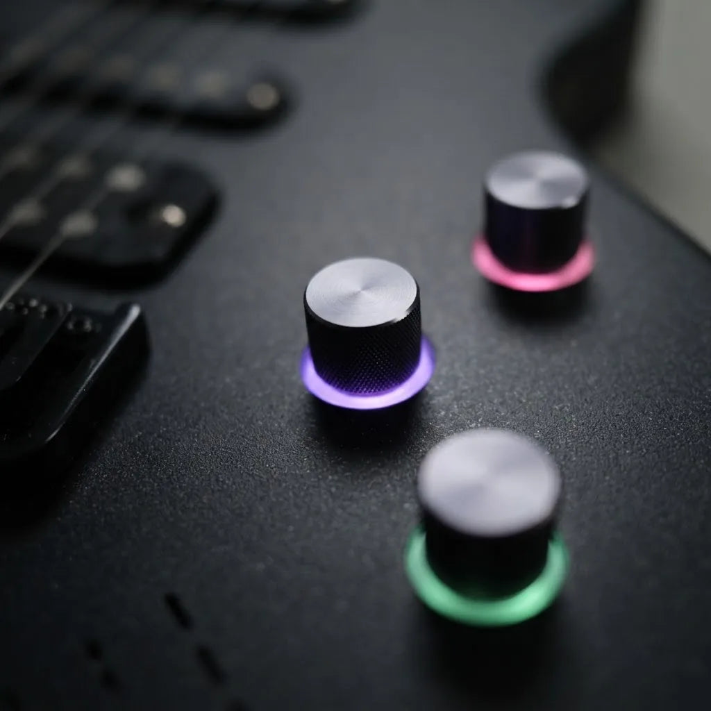 Three control knobs on the R-01, each with a lit colour ring